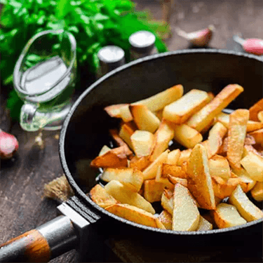 Fried potatoes with onions in a pan